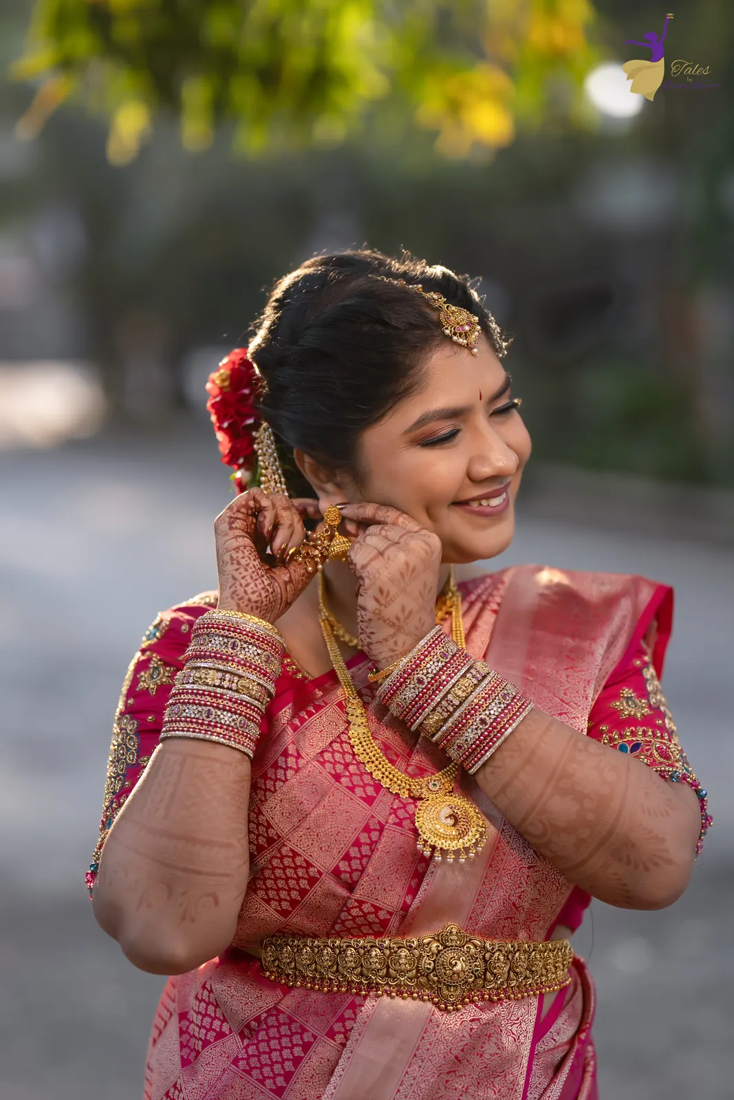 Priyanka adjusting her earring in warm early-morning backlight
