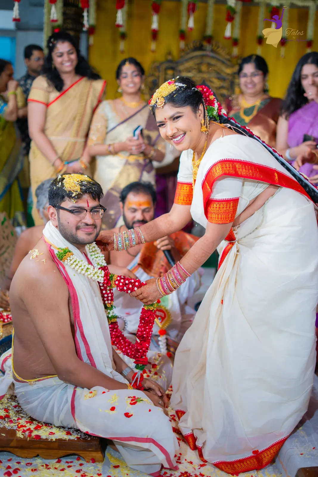 Priyanka pouring talambralu over Aditya as family laugh around them