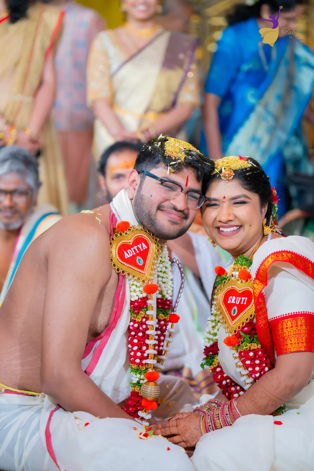 Aditya and Priyanka in rose and jasmine garlands with bashikam, Telugu wedding