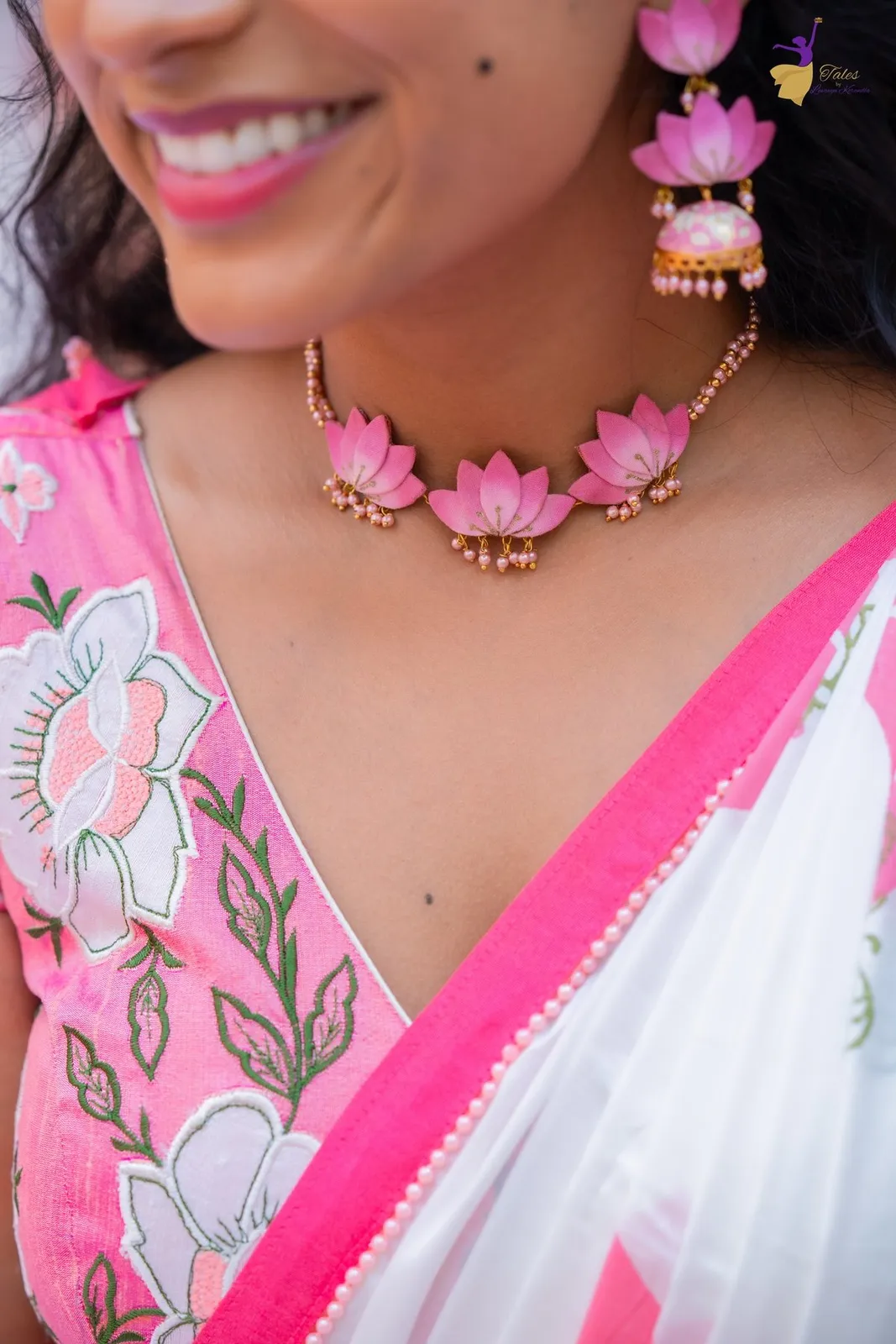 Close-up of Priya’s pink lotus necklace and embroidered blouse, Haldi
