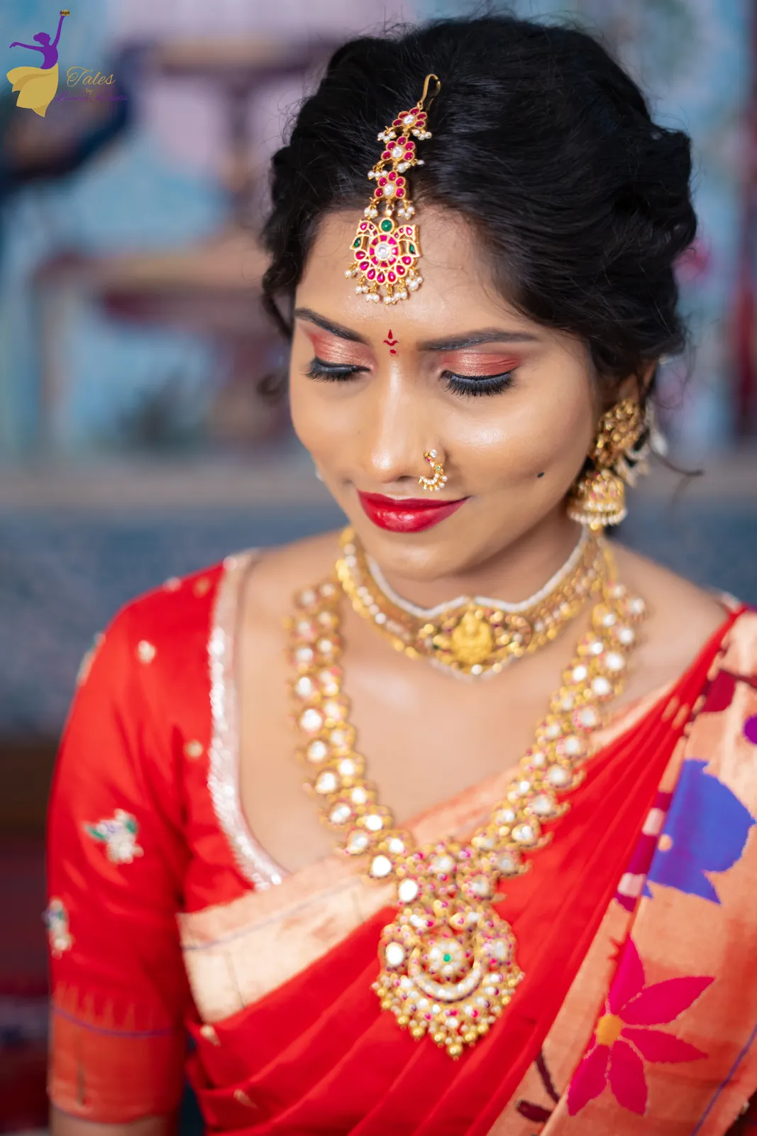 Close-up of Vishwasa in red silk with gold temple jewellery and maang tikka at her Pellikuthuru