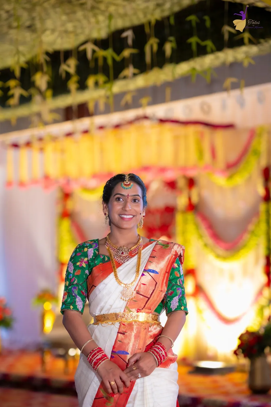 Priya smiling in white and red silk saree at her Pellikuthuru, Amalapuram
