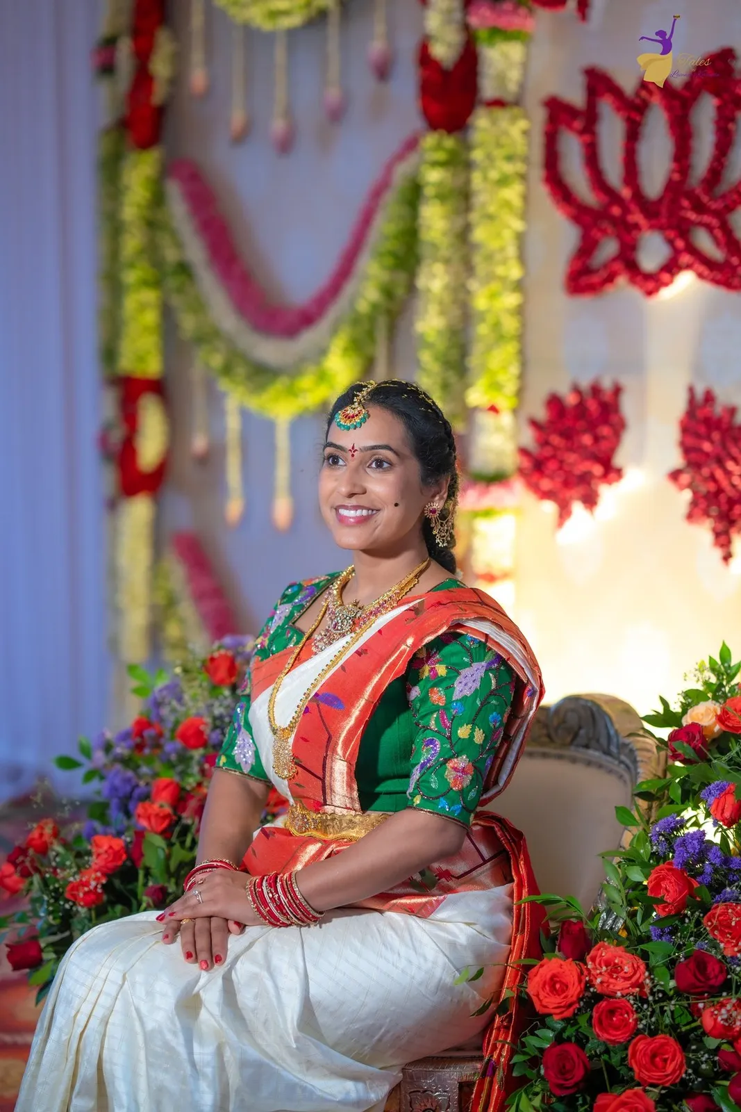 Priya seated looking aside with floral decor, Pellikuthuru, Amalapuram
