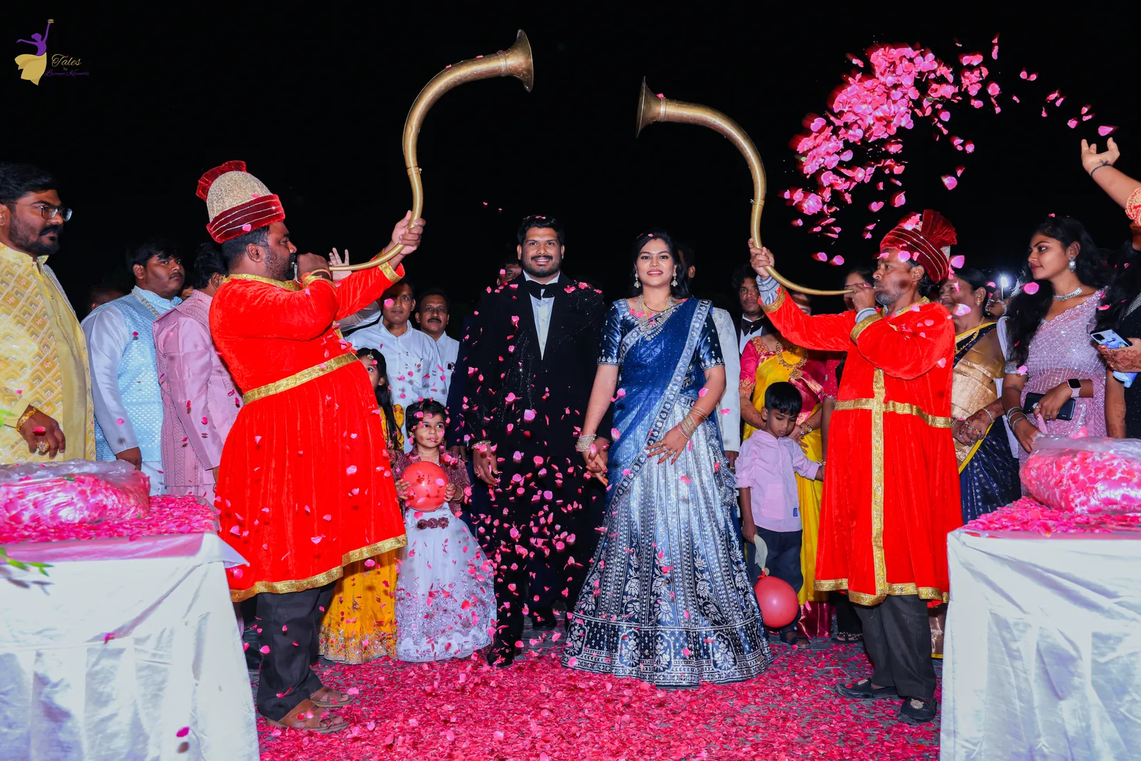 Ravinder and Anuhya’s reception entry with trumpeters and a shower of rose petals
