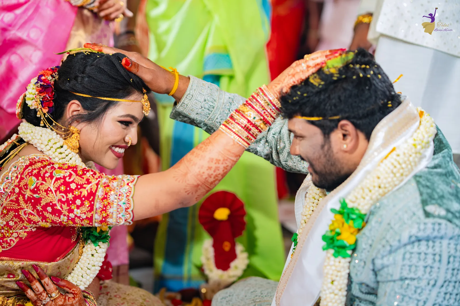 Anuhya placing jeelakarra bellam on Ravinder’s head during their Telugu wedding