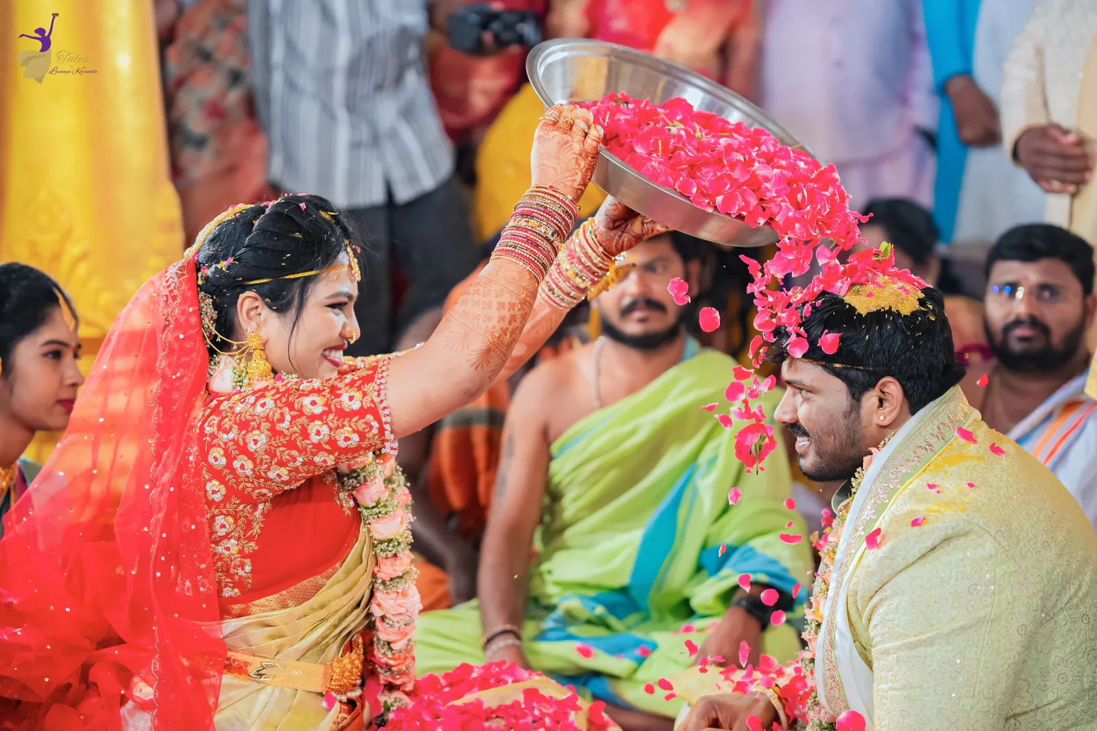 Anuhya showering talambralu over Ravinder’s head at the mandap