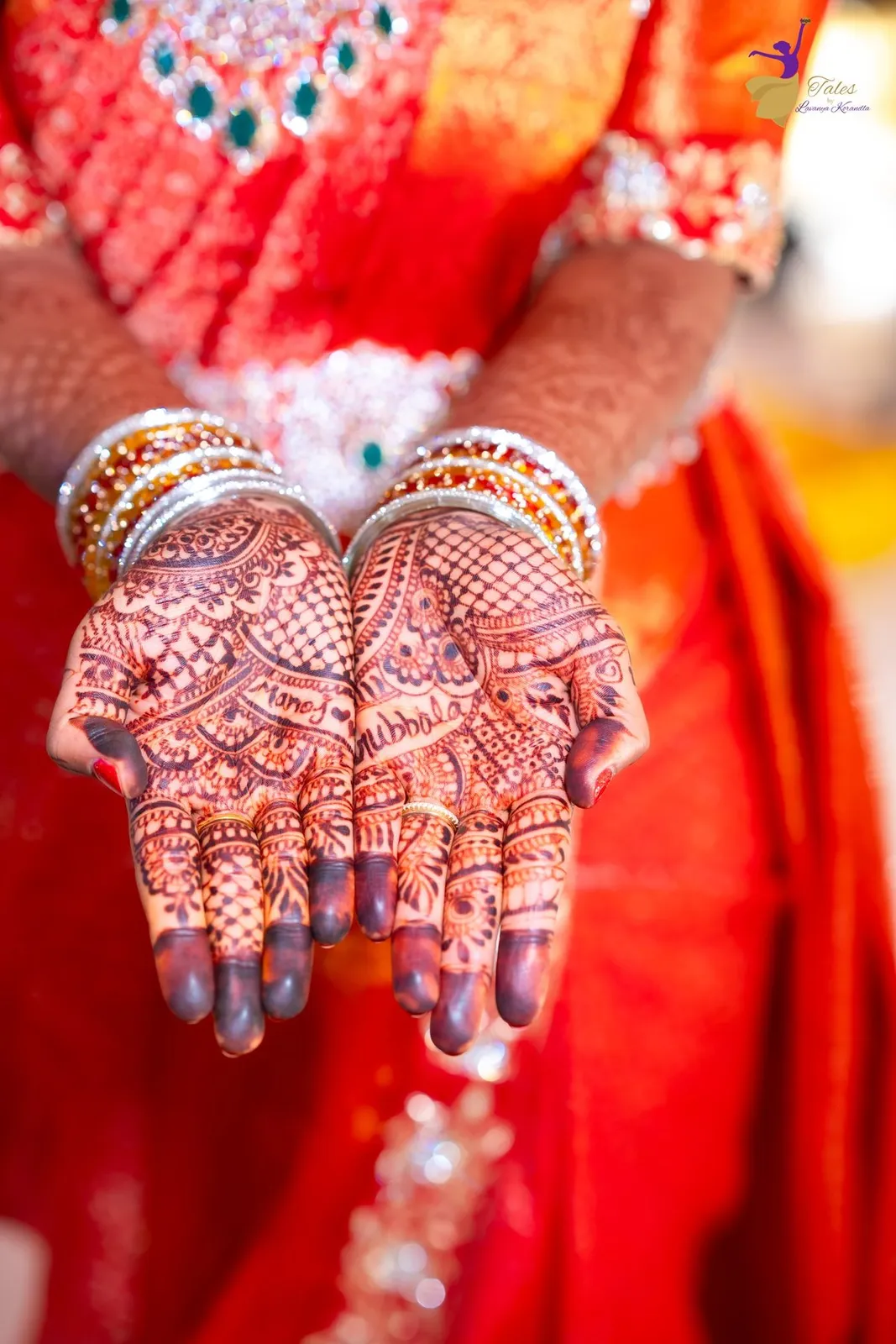 Close-up of Priya’s mehendi-painted hands on the wedding day
