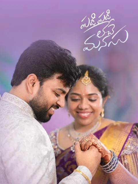 Bride in purple silk saree and groom in white sherwani holding hands, couple shoot