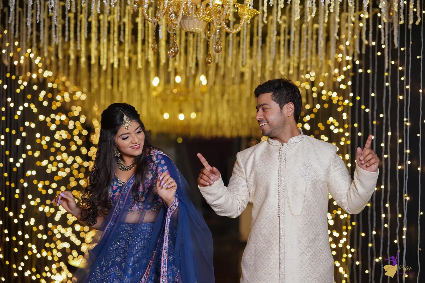 Couple dancing under warm fairy lights at a wedding reception, Hyderabad