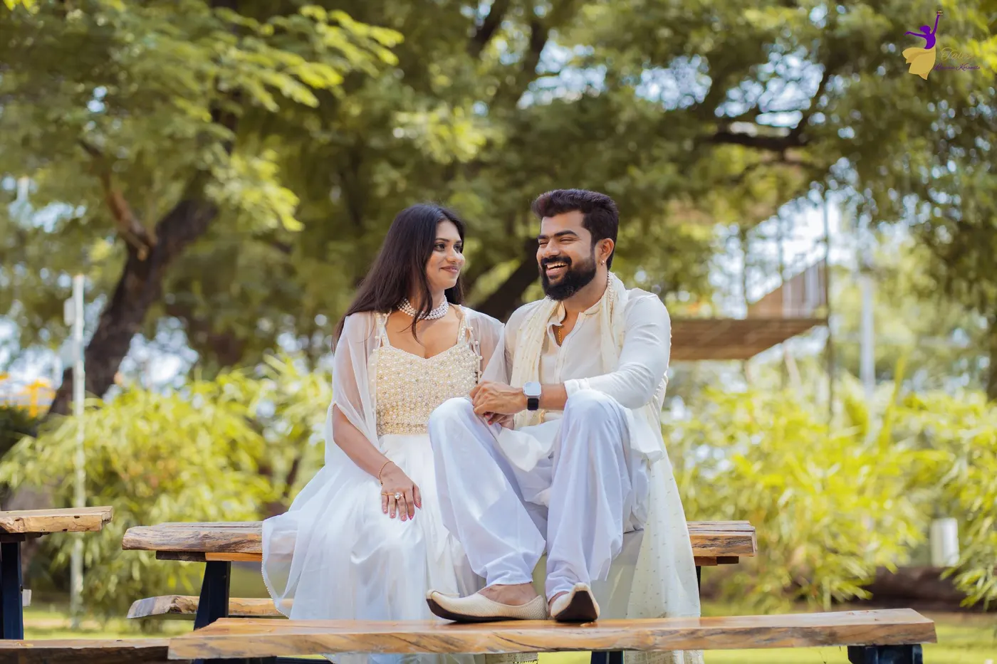 Couple posing in a grand stone temple archway, Hyderabad
