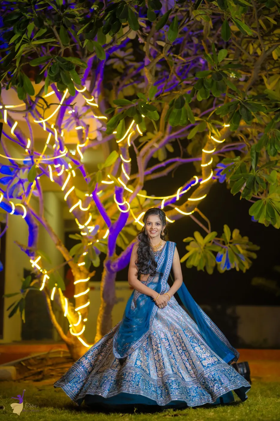 Couple dancing as sparklers light the night, wedding celebration