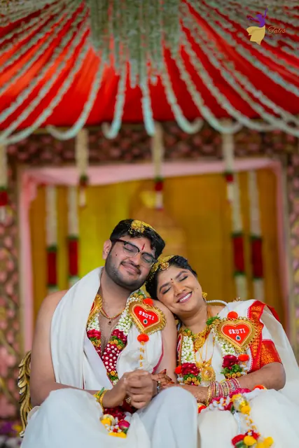 Aditya and Priyanka smiling, heads together, under the mandap canopy, Telugu wedding Hyderabad