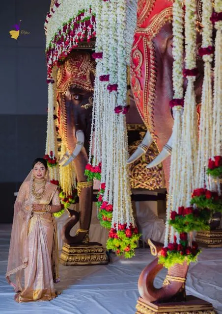 Bride on a flower-decorated wedding stage, Hyderabad