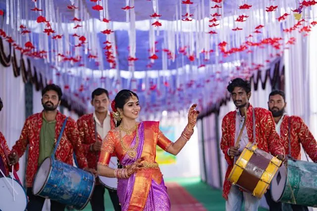 Wedding procession with musicians under a floral canopy