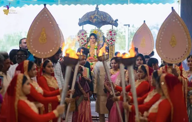 Wedding procession with ceremonial fans around the couple, Hyderabad