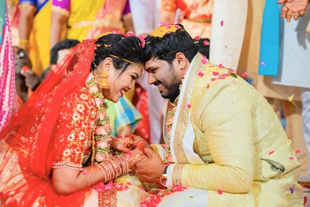 Couple seated during a wedding ritual, hands together, Hyderabad