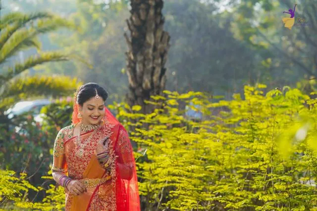 Bride in red saree in warm outdoor light, Hyderabad